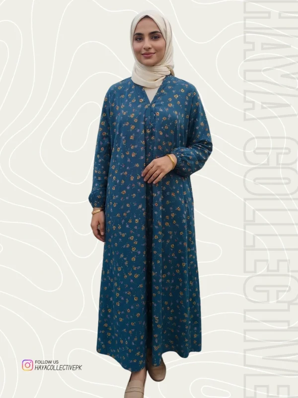 Full-length portrait of a woman in a floral abaya at sunset